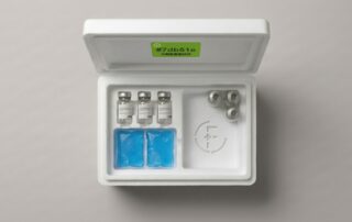 Unused flu vaccine vials in a medical cool box, illustrating the cost of fixed vaccine ordering models used by corporate flu providers like Flu Xpress